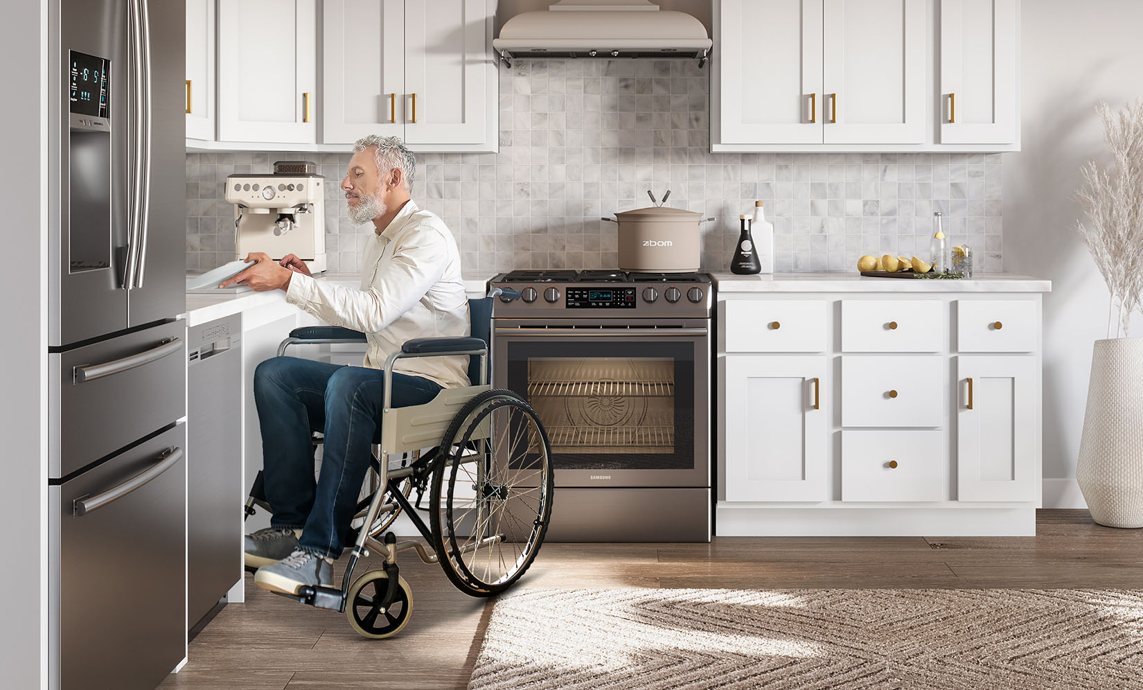 A man in a wheelchair sitting at a kitchen counter with a modern design, using the workspace comfortably.